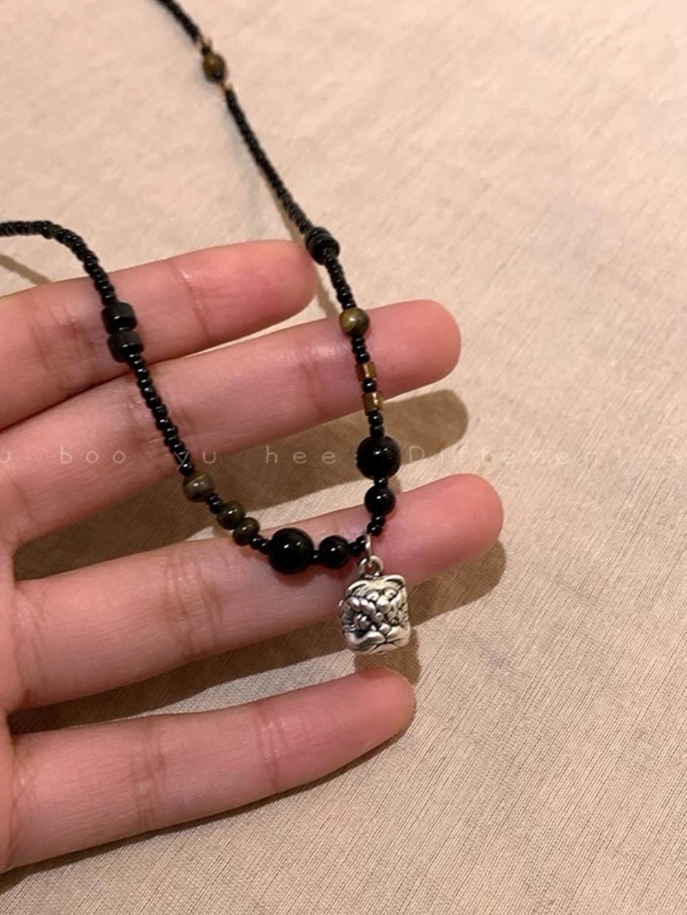 Handcrafted Black Bead Necklace with Silver Charm
